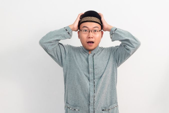 Surprised Asian Muslim man Shocked gesture in Ramadan