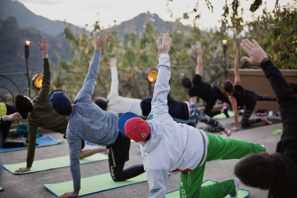 People attending yoga class
