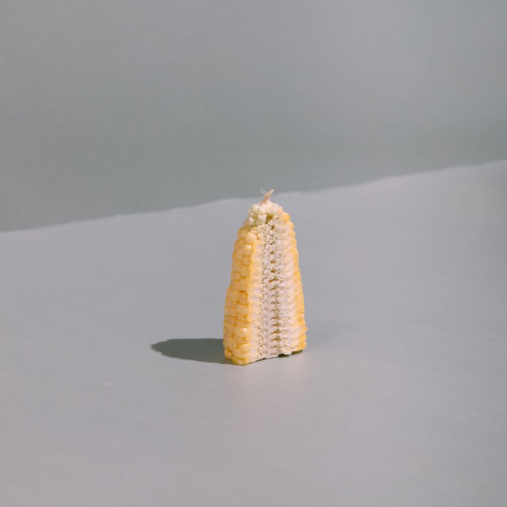Corn cut in half on kitchen table