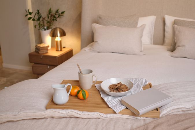 Tray with breakfast on bed