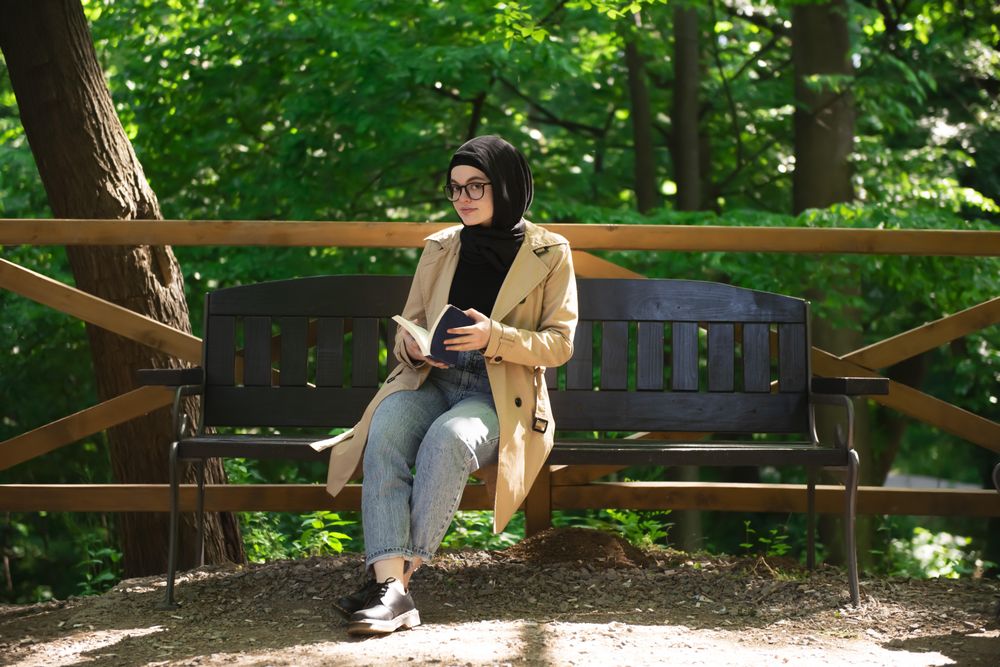 Woman with a book in the park