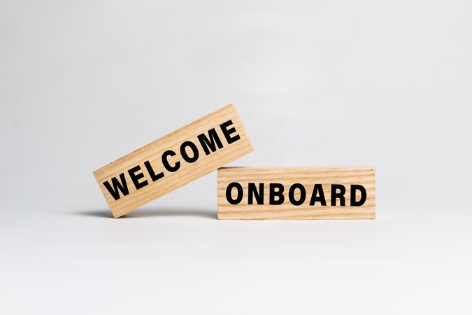 welcome onboard word text on wooden blocks