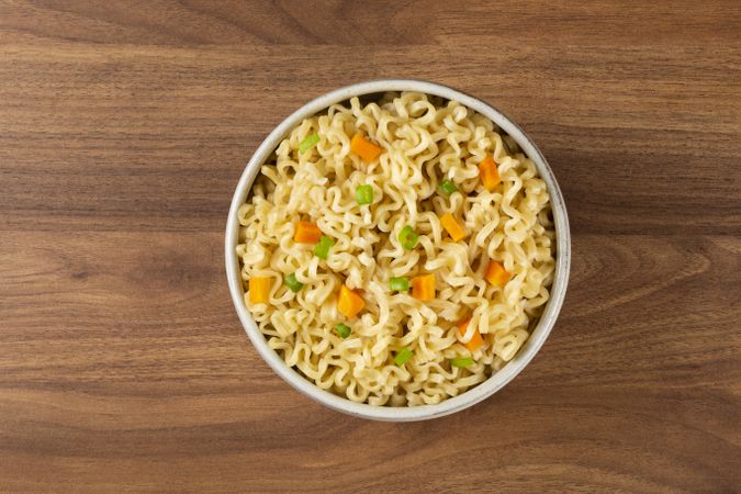 Bowl with instant noodles on the table.