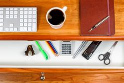 Coffee on top of cherry wood desktop