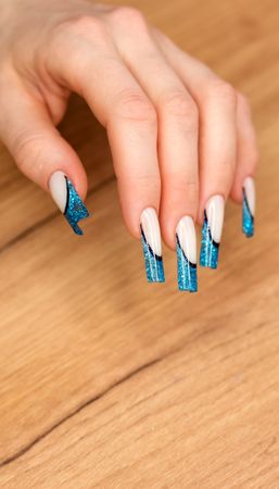 Elegant White Nails with Blue Glitter Tips