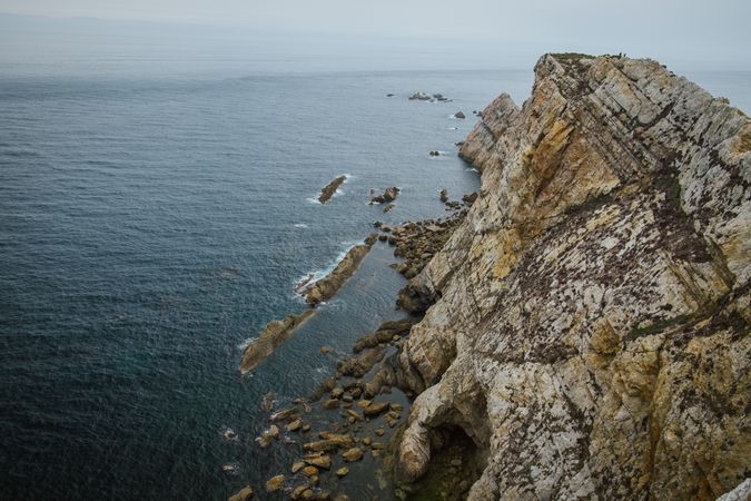 Majestic cliffs of ocean coastline in sunlight