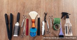 Flat lay of hairdresser’s tools on wooden surface 5qrvE4