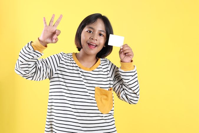 Asian Kids Holding Empty Bank Card with OK Sign