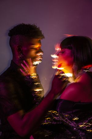 Traces of light on faces of couple