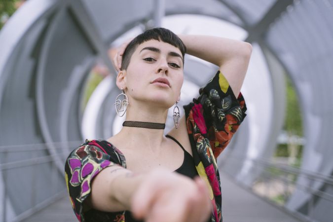 Woman in colorful shirt posing
