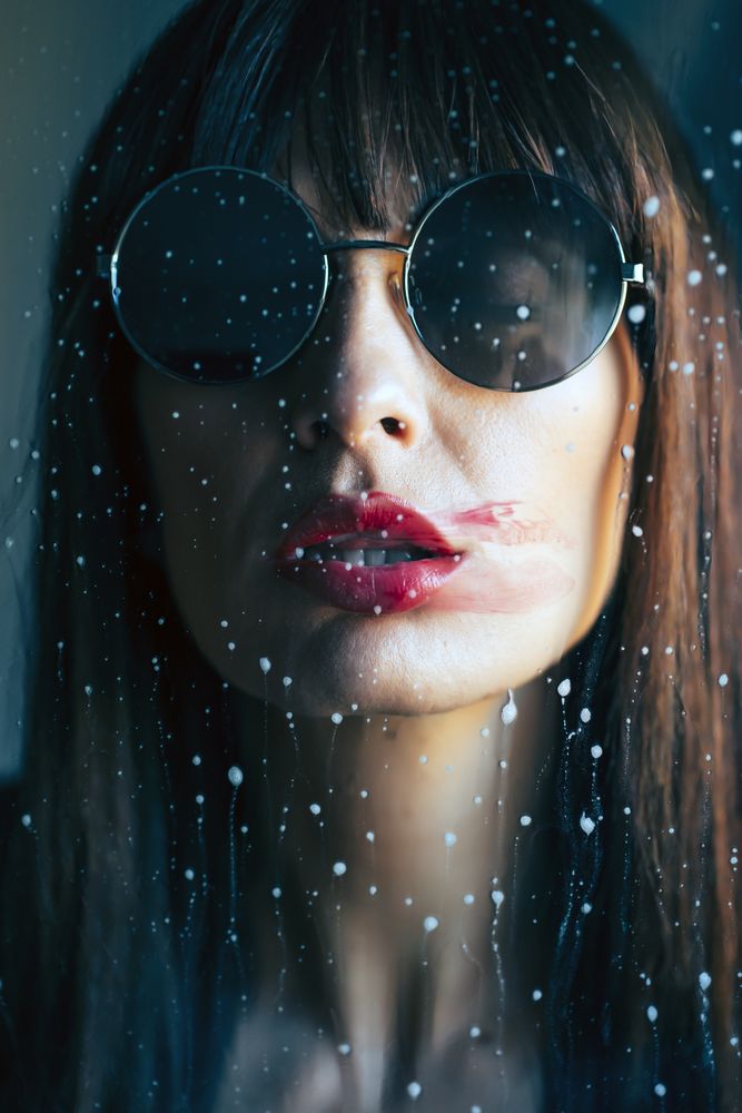 Stylish woman kissing glass