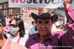 Mexico City, Mexico - February 26th, 2022: Man in leather cowboy hat at protest in Mexico City bEqw1b