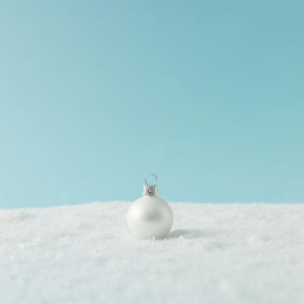 Christmas bauble on snow