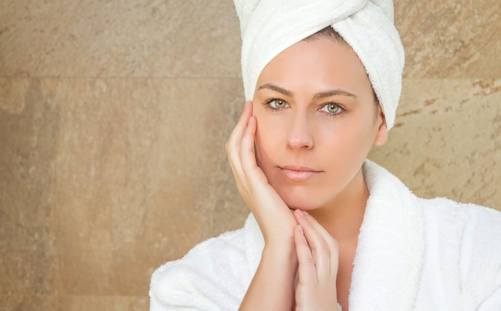 Portrait of woman with a white bathrobe