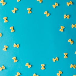 Pattern made of pasta on blue background