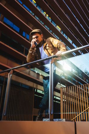 Man using mobile phone in modern building