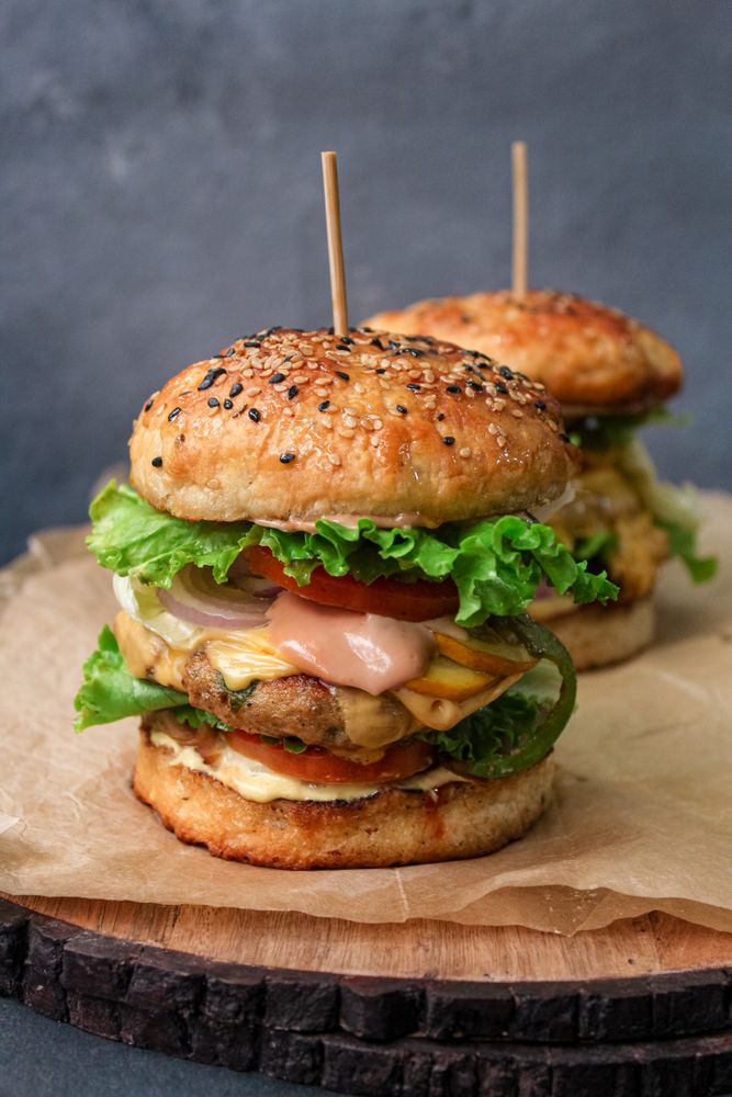 Chicken burger on a wooden board