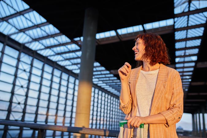 Smiling young female at station