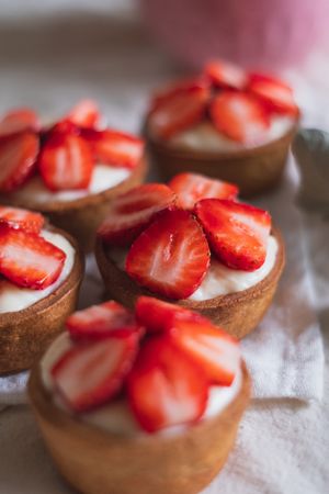 Close-up of five strawberry mini tarts