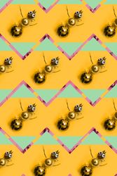Rows of gold bauble snowman, on orange and green background