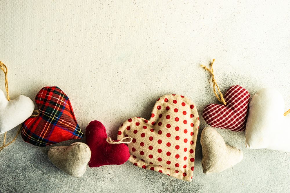 Valentine's concept with multicolored heart ornaments and copy space