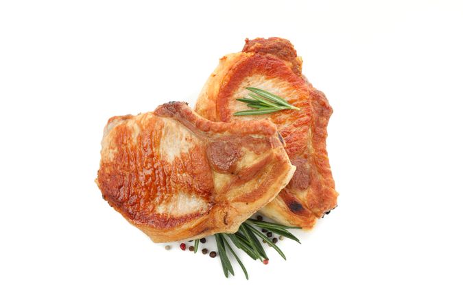 Fried pork steaks isolated on blank background. Grilled food