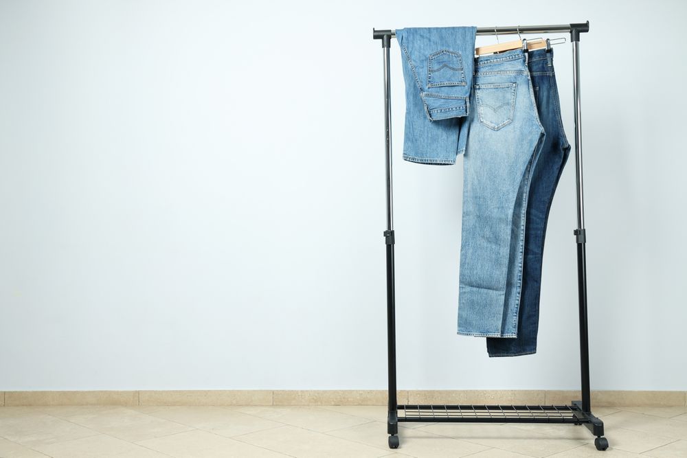 Jeans hang on hangers