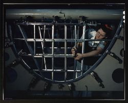 Fort Worth, TX, USA - 1942: Female a mechanic at a western aircraft plant