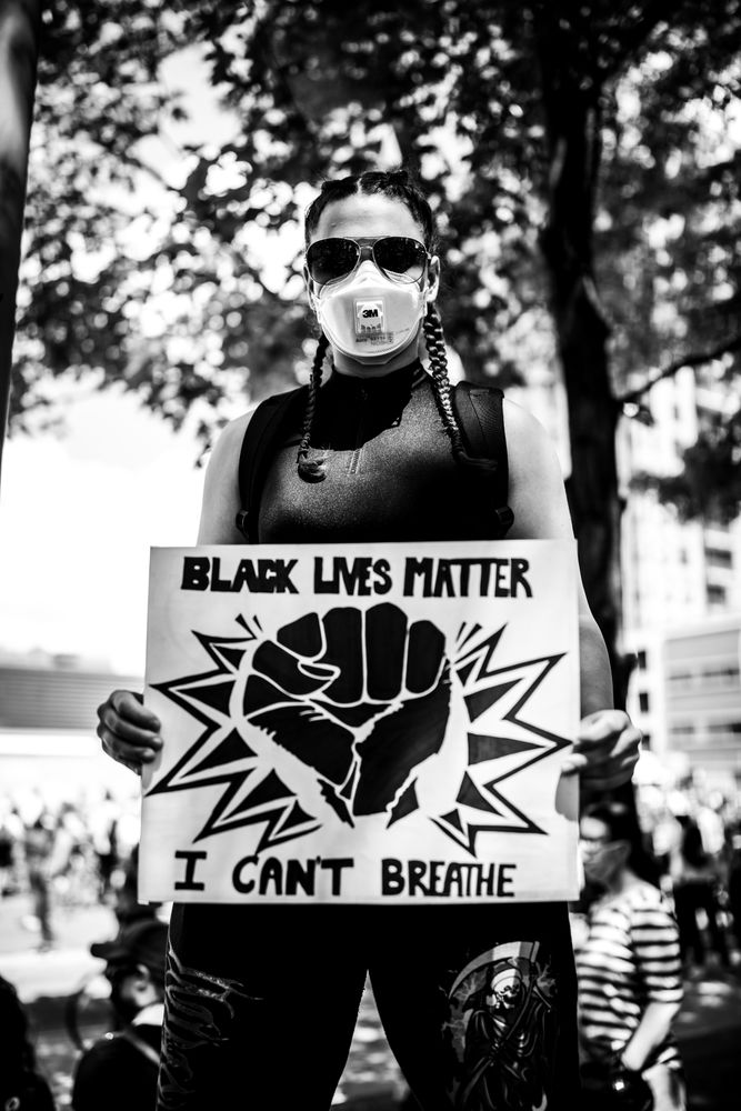MONTREAL, QUEBEC, CANADA – June 7 2020- Person holding a sign during a protest