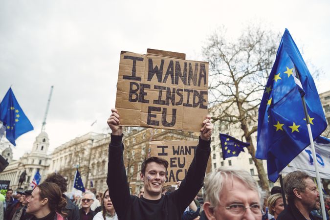 London, England, United Kingdom - March 23rd, 2019: Man holds funny protest sign with innuendo