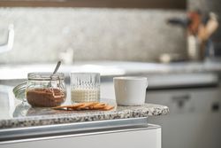 Cup of fresh coffee with glass of milk and cookies