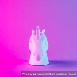 Painted unicorn head in bold pink and blue neon colors on gradient background 496Bnb