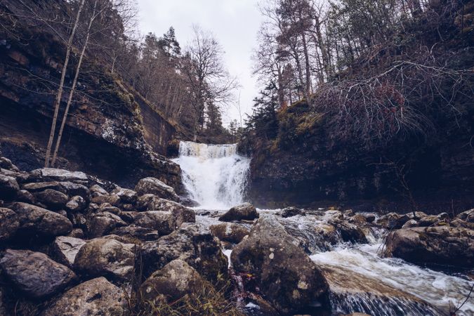 Cascade mountain river at autumn forest