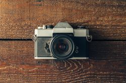 Vintage camera on wooden background