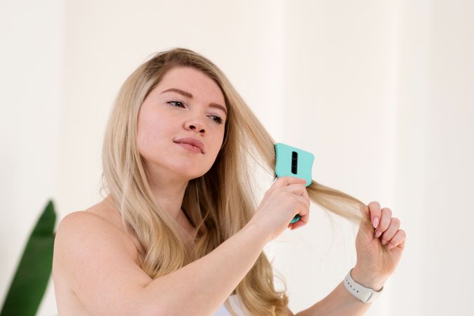 Hair brushing as part of morning routine.