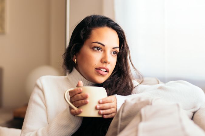 Enjoying Morning at Home: Young Woman Drinking Coffee
