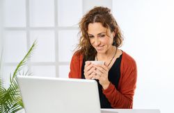 a woman working on the laptop talking on video call