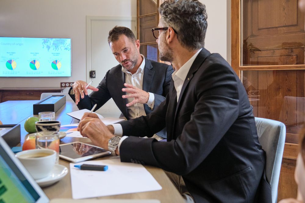 Businessmen sharing ideas during meeting