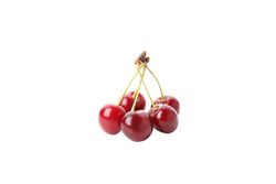 ripe cherry fruits, isolated on light background