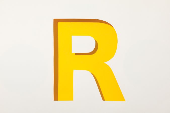 Color letter R on blank background, space for text