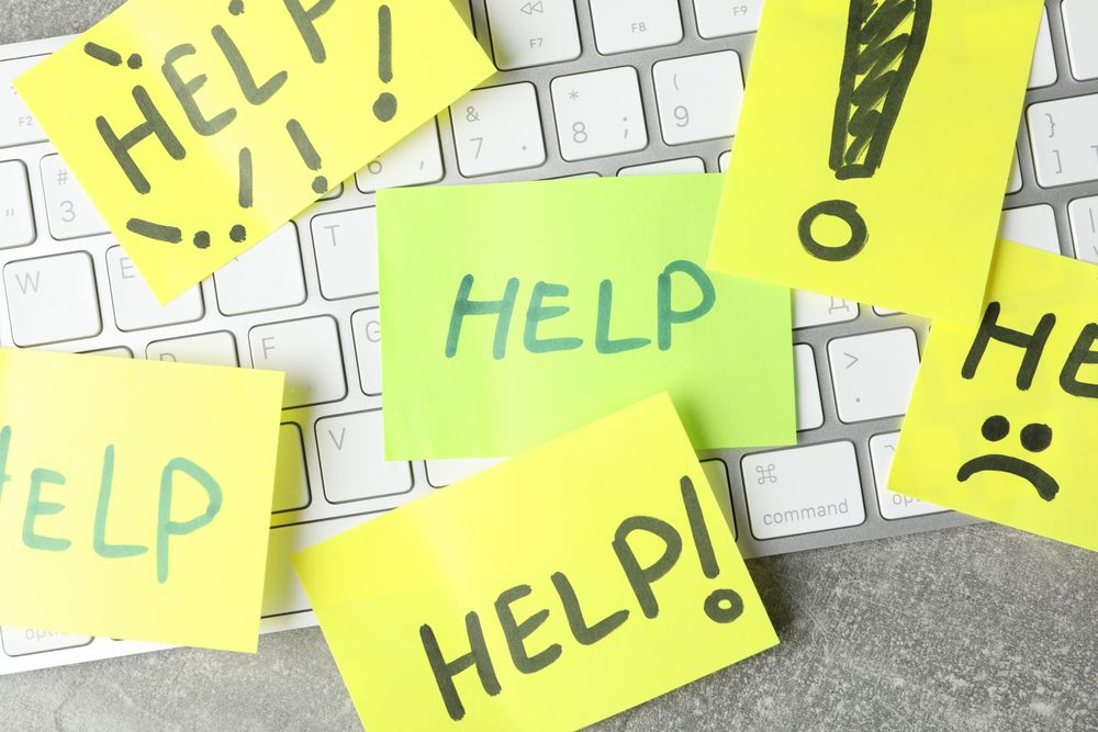Looking down on sticky notes on keyboard