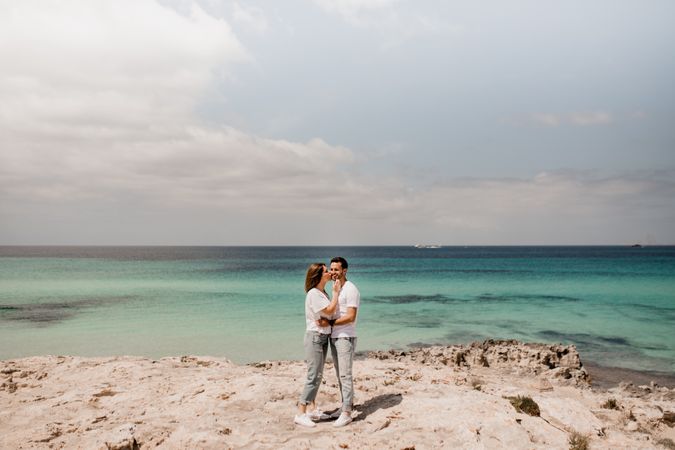 Loving couple embracing on coastline
