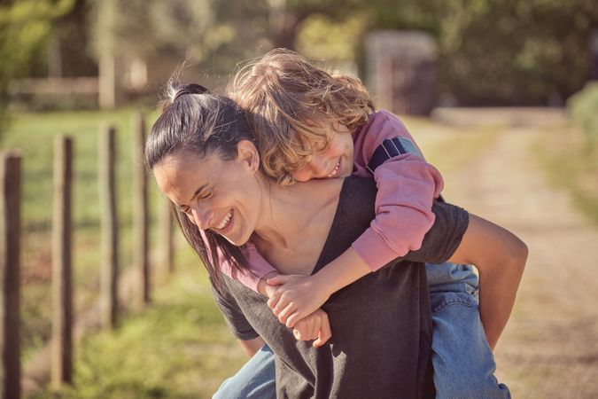 Happy mother and son in countryside