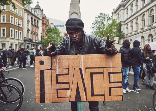 London, England, United Kingdom - June 6th, 2020: Man in beret with peace sign at BLM protest
