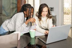 Two students doing their assignment at home