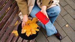 Woman on park bench in autumn