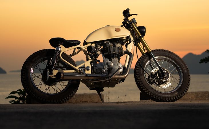 Motorbike near sea during sunset
