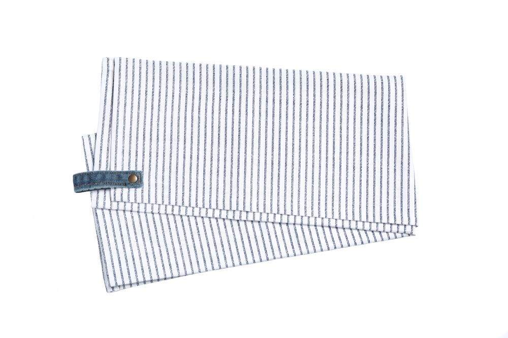Folded fabric napkin isolated on plain background