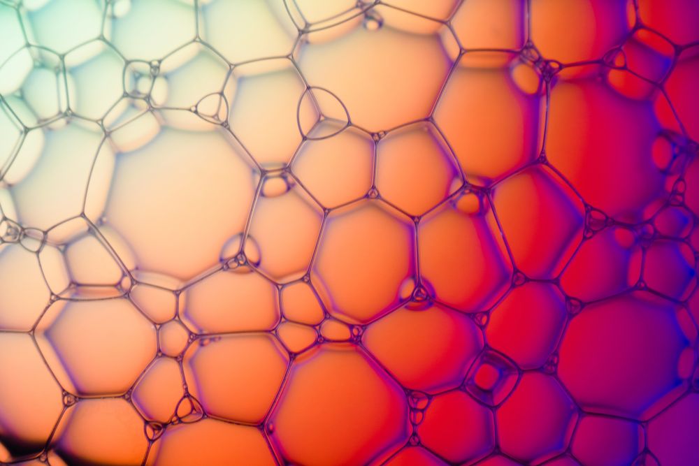 Abstract background bio technology, macro photography foam and water with gradient background. Molecule multicolor backgorund