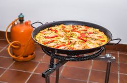 Traditional spanish paella cooking in a pan